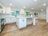 LARGE island for prepping and SMART seating that wraps the corner for ease of conversation
