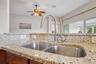 Kitchen Sink with New Faucet and Granite Countertops