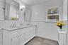 Upstairs Brand new bath with double white vanity, mirrors, farmhouse