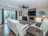 Family room/ Den with sliders to outdoor patio and yard