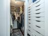 Walk in closet attached to primary bedroom