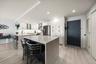 Additional kitchen island maximizes this space & provides additional dining or work space