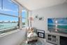 Primary bedroom is a sanctuary with stunning water views.