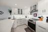 Well appointed kitchen with oversized island; perfect for dining & entertaining.