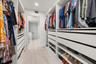 Fully updated closet with smart custom closet design.