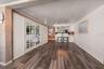 AI Image of Potential Living Room Conversion into 3rd Bedroom
