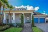 Welcome to 8336 Canetti St in Laureate Park, Lake Nona, Orlando FL 32827. A 2020 David Weekley Shalimar with contemporary curb appeal, lush palms, and