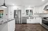 Kitchen with stainless steel appliance.