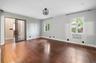 Primary bedroom leads to laundry, a walk-in closet and additional pool access.