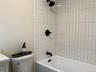 full bath off hallway and adjacent to bedroom