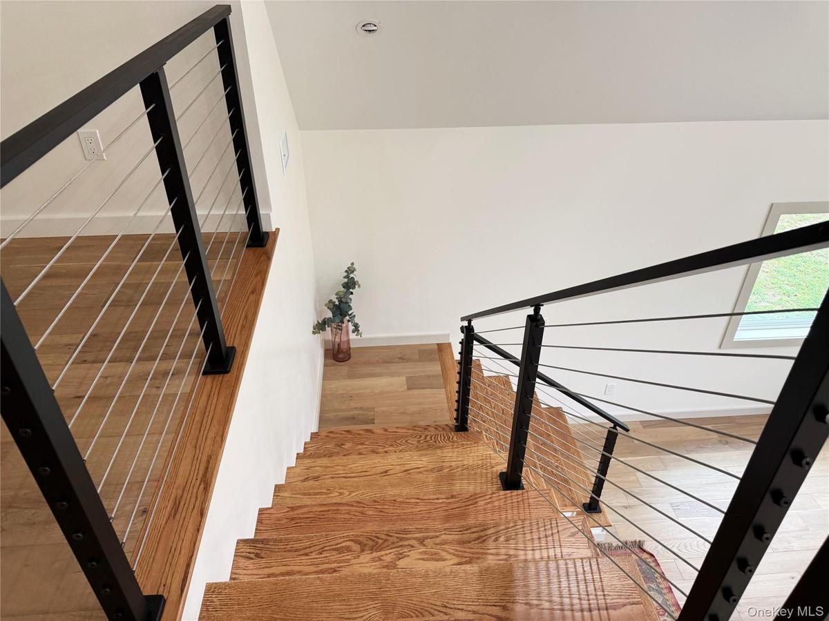 staircase to the dramatic loft and extra bedroom
