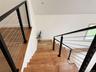 staircase to the dramatic loft and extra bedroom