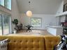 the open design, main room with living area and dining room with custom kitchen//