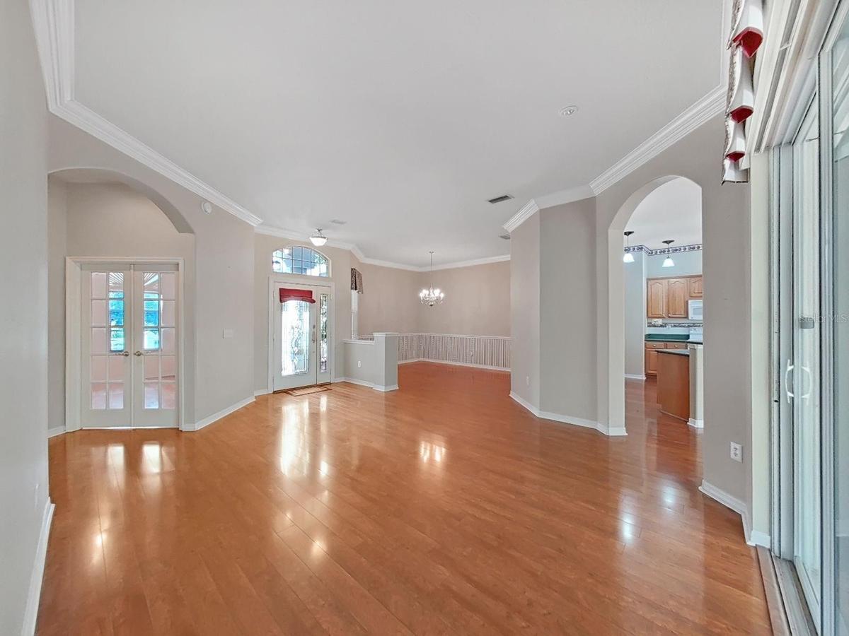 L-R:    Office ~ Front Entry ~ Dining Room ~ Kitchen ~ Living Room Area