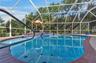 Large family pool has a cascading spa
