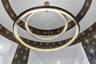 Statement circular chandelier set within an accent tray ceiling. Designer details throughout this Laureate Park home.