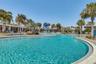 Laureate Park resort style pool with lounge deck and palm trees in Lake Nona.