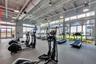 Bright community fitness center with cardio equipment and floor to ceiling windows in Laureate Park, Lake Nona.