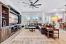 Family room with custom built in entertainment center and an easy connection to the kitchen and dining area.