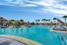 Sparkling community pool with water slide and sun deck, an everyday resort experience in Lake Nona.