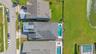 Overhead aerial showing the home, private pool, and fenced backyard.