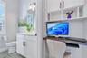 Built in office nook with desk and shelving, a functional workspace for working from home.