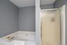 Primary Bathroom with Tub and Shower