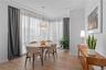 Dining space with light wood finished floors and a wealth of natural light