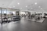 Exercise room featuring expansive windows and recessed lighting