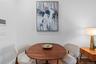 Dining space with baseboards and wood finished floors