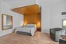 Bedroom featuring baseboards, visible vents, and light wood-style floors