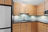 Kitchen featuring appliances with stainless steel finishes, a sink, and backsplash