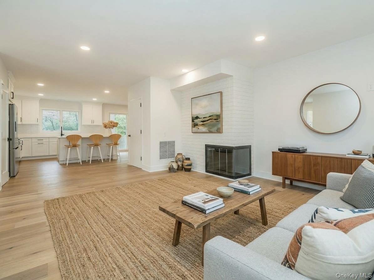 AI GENERATED: An idea of what the living room could feel like with furniture.