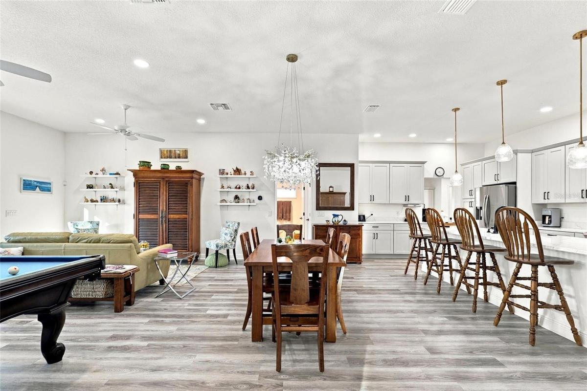 Dining Room with Living Room to the left and Kitchen to the right
