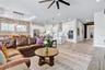 Living area designed for gathering, open to the kitchen and dining space. A natural flow for entertaining in this Orlando 32827 home.