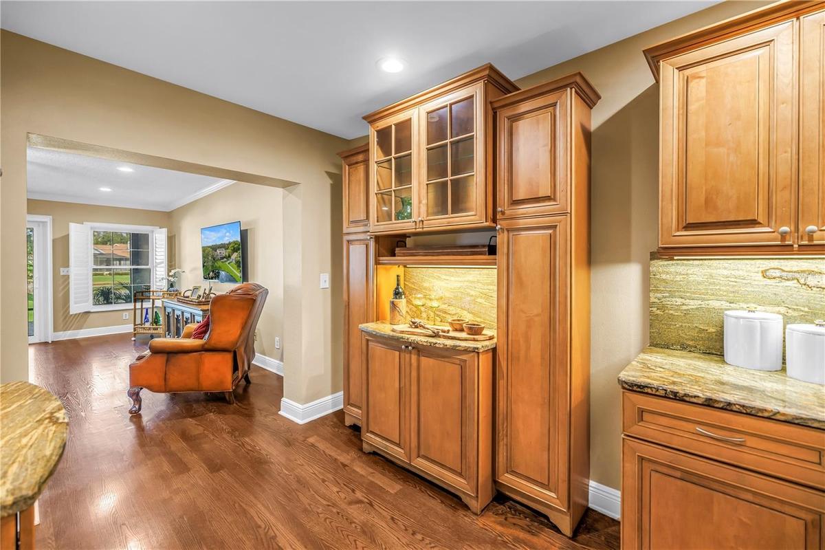 This space features a matching bar area for charcuterie or appetizers, positioned opposite the dedicated beverage station. The design includes matchin
