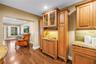 This space features a matching bar area for charcuterie or appetizers, positioned opposite the dedicated beverage station. The design includes matchin
