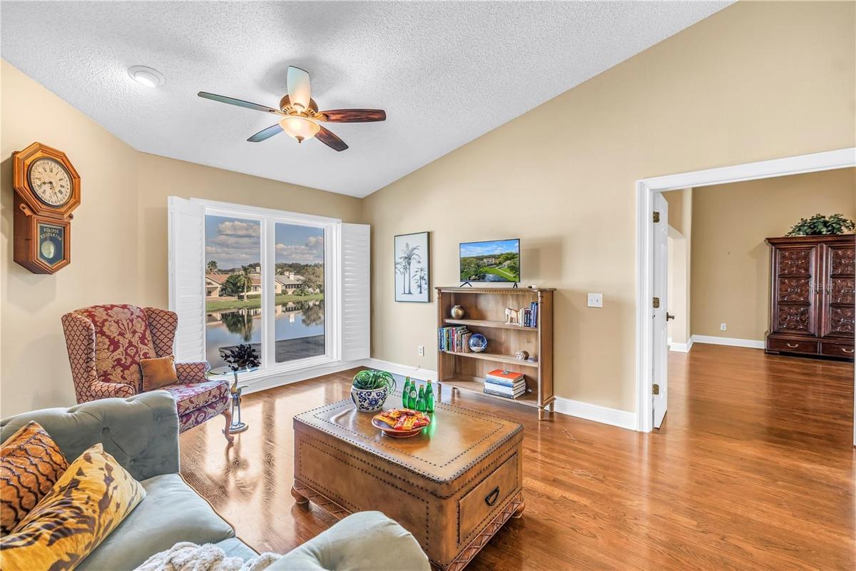 This unique upstairs bonus living space in Caya Costa features vaulted ceilings and premium hardwood flooring. The room offers expansive views of the 