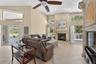 Family room is open to the kitchen, overlooks the pool and has a wood burning fireplace