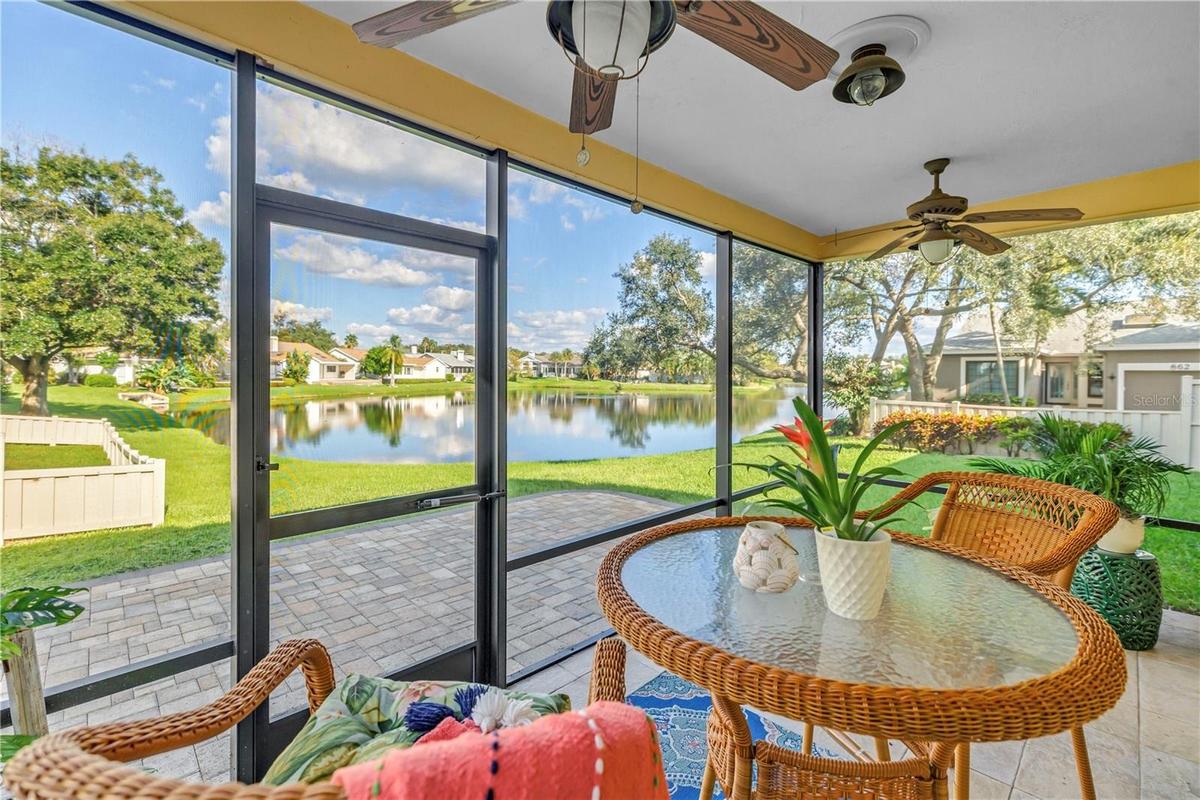 This covered, screened patio provides an ideal setting for enjoying scenic lake views and local wildlife, whether you are relaxing with a beverage or 
