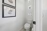 WATER CLOSET IN THE PRIMARY BATHROOM