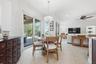 DINETTE WITH LOVELY LIGHT FIXTURE, NEW SLIDING DOORS WITH MOTORIZED BLINDS