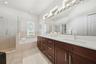 PRIMARY BATHROOM WITH NEW SEAMLESS GLASS ENCLOSURE, TUB AND DOUBLE SINK VANITY