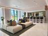 Common area featuring floor-to-ceiling windows, polished tile flooring, recessed ceiling lighting, and a built-in bar with mirror backsplash