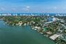 Waterfront property featuring direct maritime access, a private dock, and an expansive backyard situated along a deep-water canal