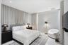 Wall-to-wall floor-to-ceiling drapery, recessed ceiling lighting, and smooth surface flooring