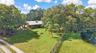 Home surrounded by beautiful mature trees.