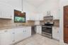 Kitchen with solid oak cabinets and granite counters.