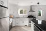 Natural light plays off the stainless appliances.