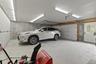 This well-lit, poured concrete two car garage with no pillars was added to the house in 2000.